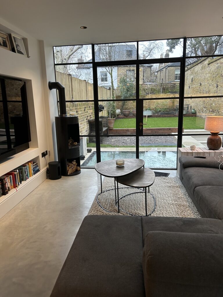 Living room with full-width Crittall doors to the garden in Victorian house renovation, Battersea SW11