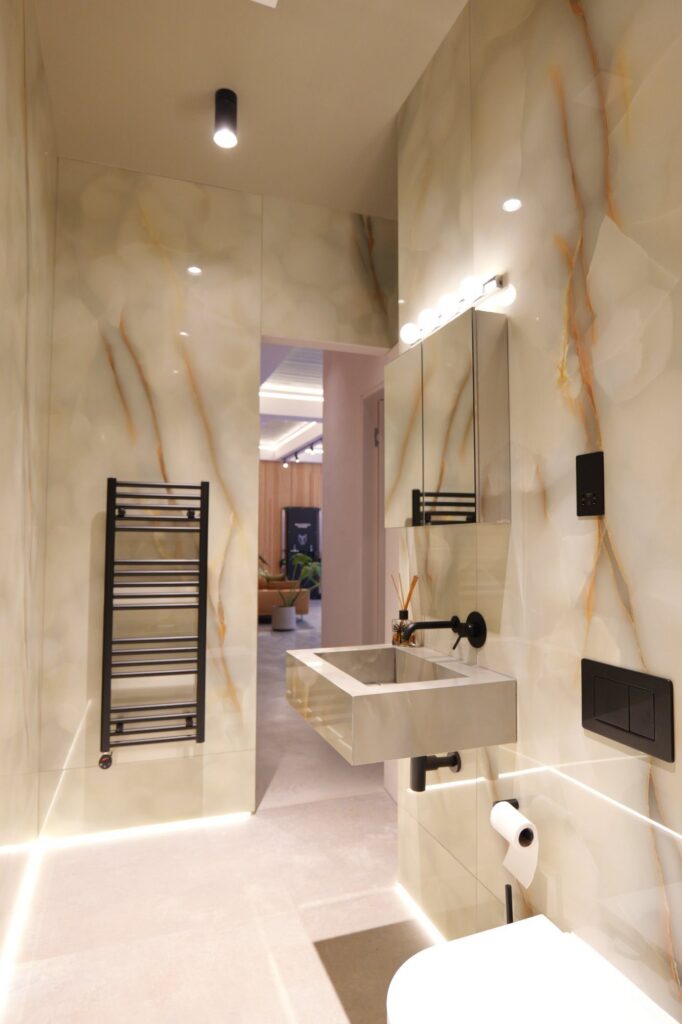 Basement cloakroom with onyx-effect wall panels, 31 Edna Street