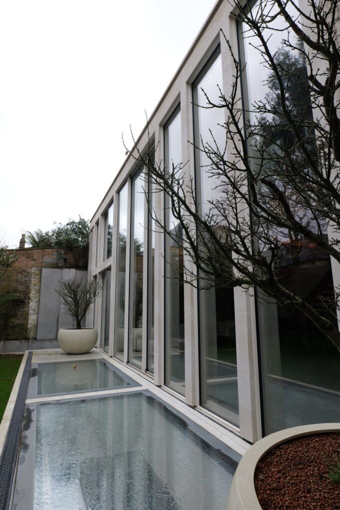 Walk-on glass rooflights bringing daylight into the basement at 31 Edna Street