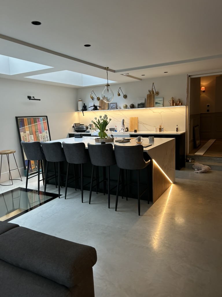 Kitchen island with LED lighting and polished concrete floor in Victorian house renovation, Battersea SW11
