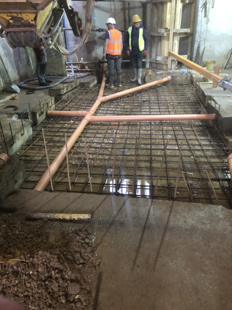 Excel Construction team preparing to pour the reinforced basement slab