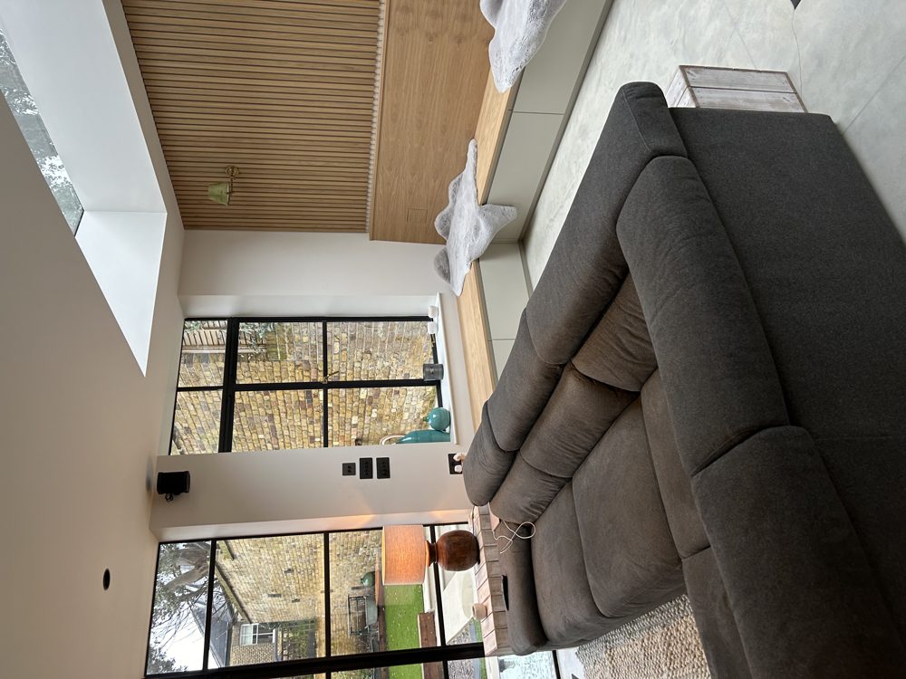 Rear extension with large rooflight, slatted oak wall panelling and built-in bench seating