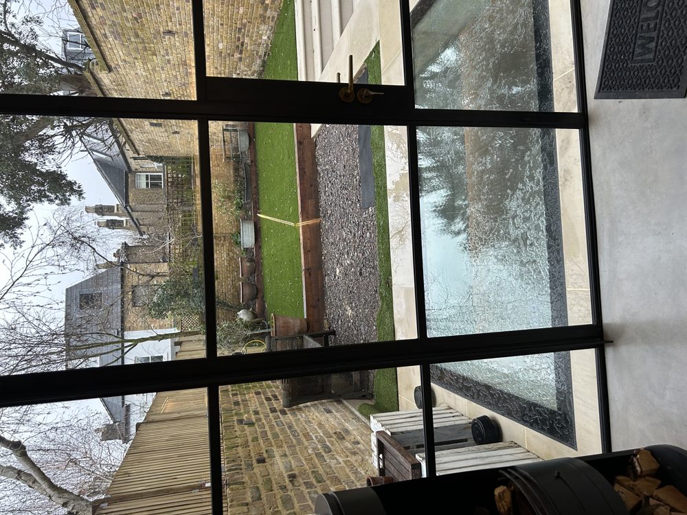 Walk-on glass rooflight in the terrace bringing daylight into the new basement